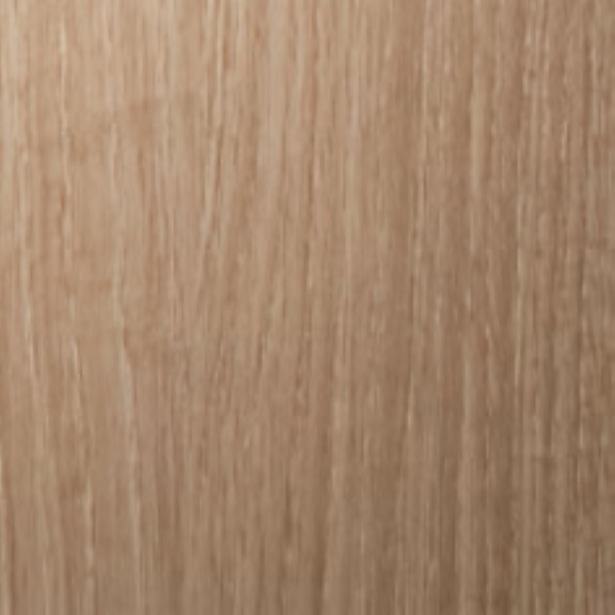 Close-up of a wooden surface with a light brown color and visible grain pattern.