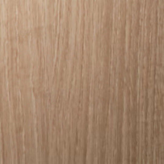 Close-up of a wooden surface with a light brown color and visible grain pattern.