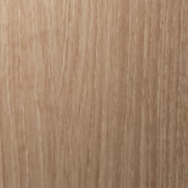 Close-up of a wooden surface with a light brown color and visible grain pattern.