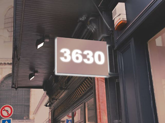 Digital display with the number '3630' on a building exterior.