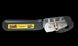 Metal tool with a black handle and visible branding on a black background